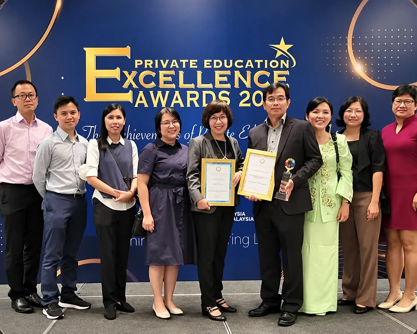 Axcel team receiving an award at the Private Education Excellence Awards