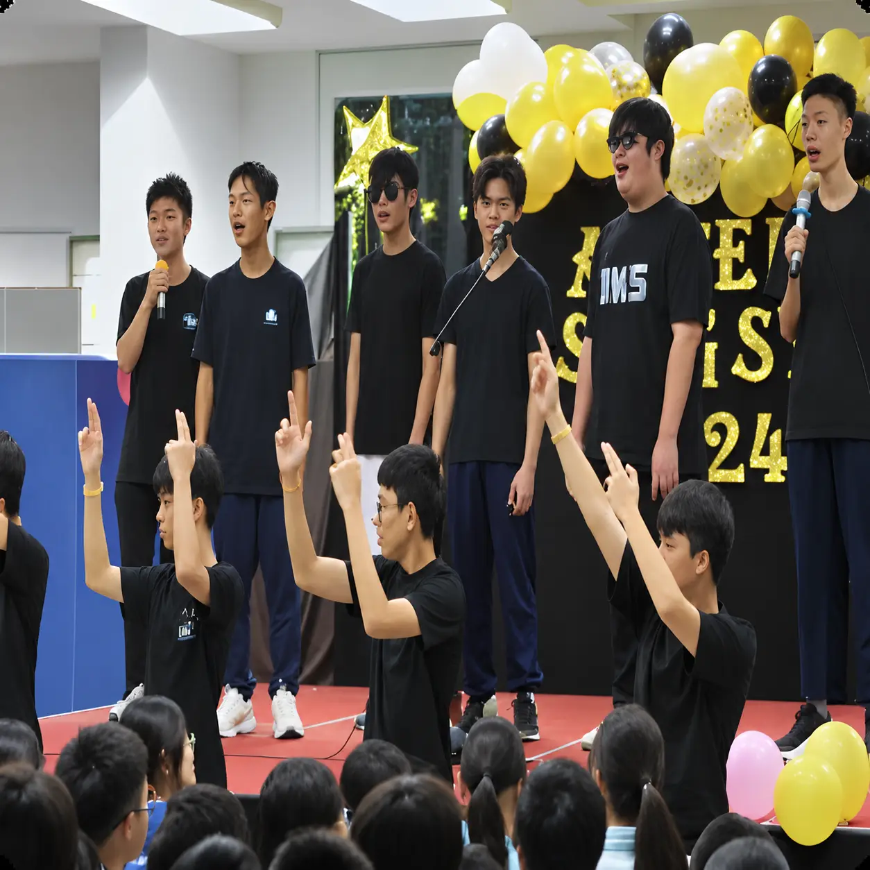 Students performing a dance on stage